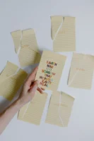 A hand holding a note - Credits: pexels