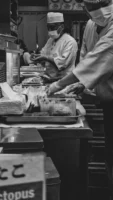 Monochrome image of sushi chefs - Credits: pexels