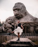 A joyful woman poses playfully - Credits: pexels