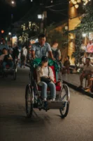 Asian man and woman riding - Credits: pexels