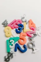 Vibrant plastic numbers scattered on - Credits: pexels
