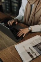 Woman working on a laptop - Credits: pexels