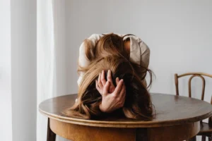 A woman showing despair with - Credits: pexels