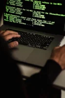 Crop anonymous male cyber spy - Credits: pexels