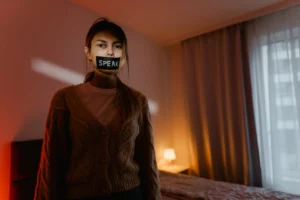 A woman stands in a - Credits: pexels