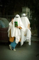 Two people dressed as ghosts - Credits: pexels