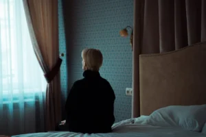 A woman in a dark - Credits: pexels