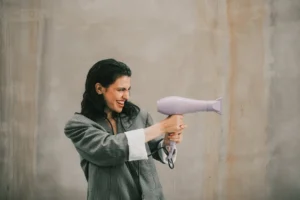 Playful woman in casual attire - Credits: pexels