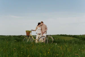 Loving couple with a bike - Credits: pexels